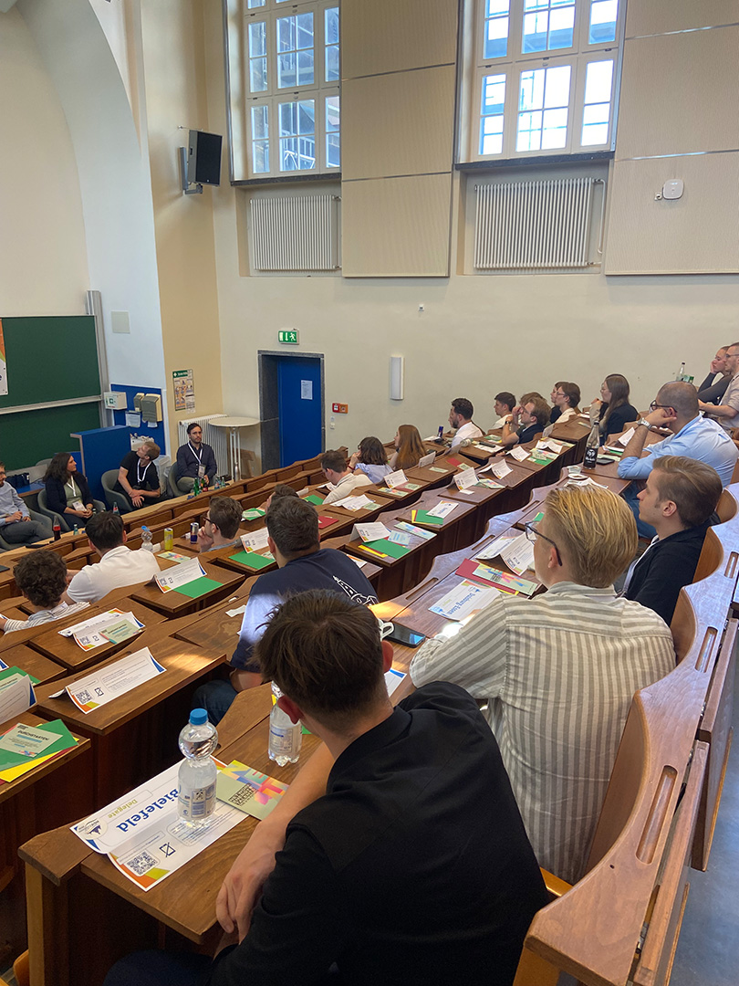 Students watch a panel discussion in a lecture theatre at TU Dresden